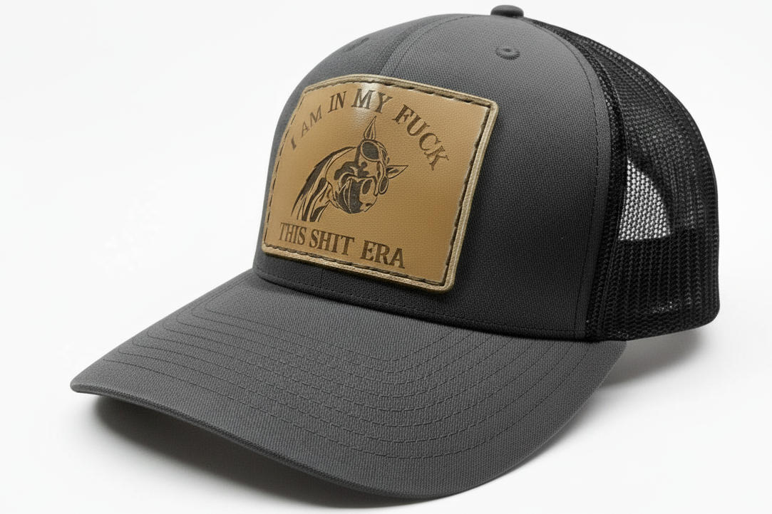 Gray and black cap with a leather patch on a white background