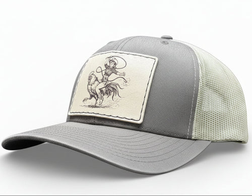 brown and khaki cap with a cowgirl riding a rooster and cowboy patch 
