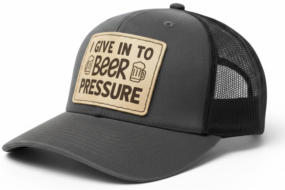 Gray cap with a brown patch saying 'I Give In to Beer Pressure' on a white background