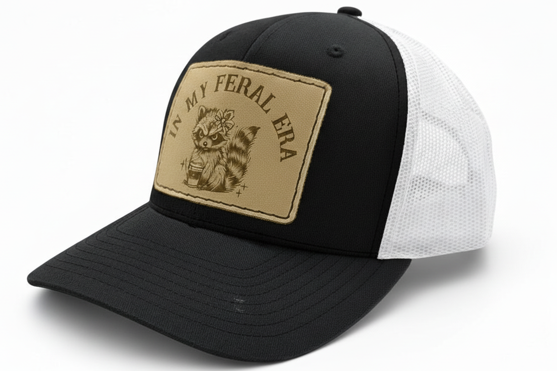 Black and white cap with a brown patch featuring text and an animal illustration on a white background