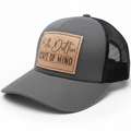 Gray and black cap with a leather patch on a white background