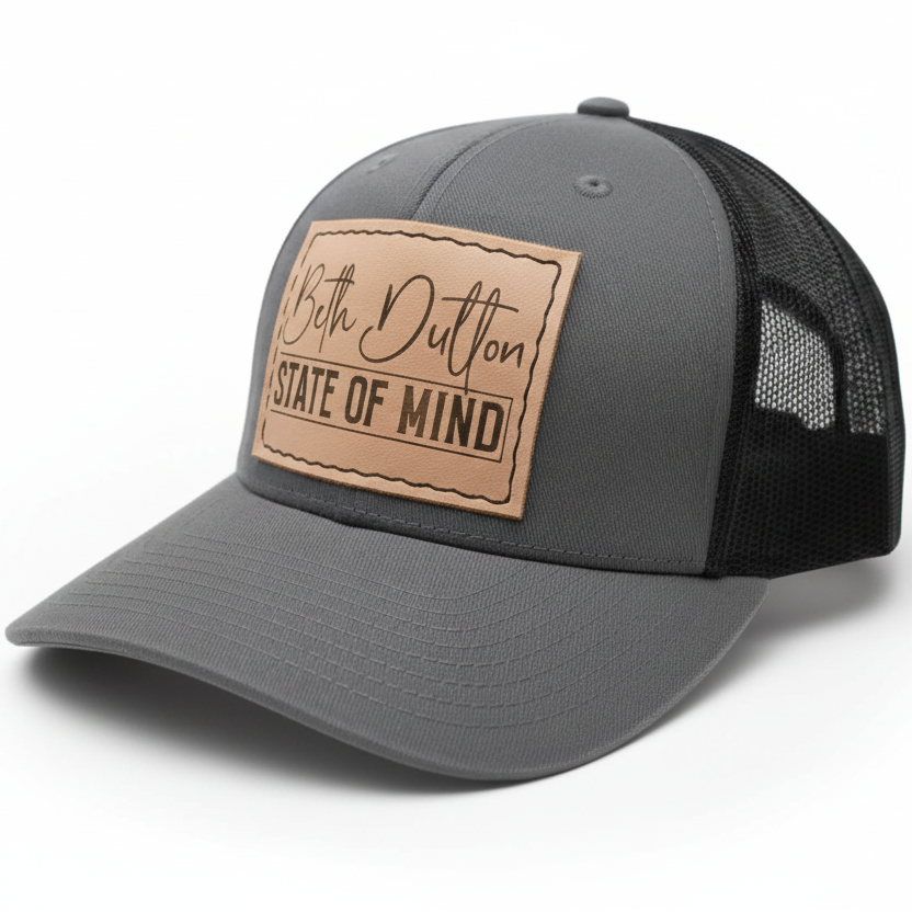 Gray and black cap with a leather patch on a white background