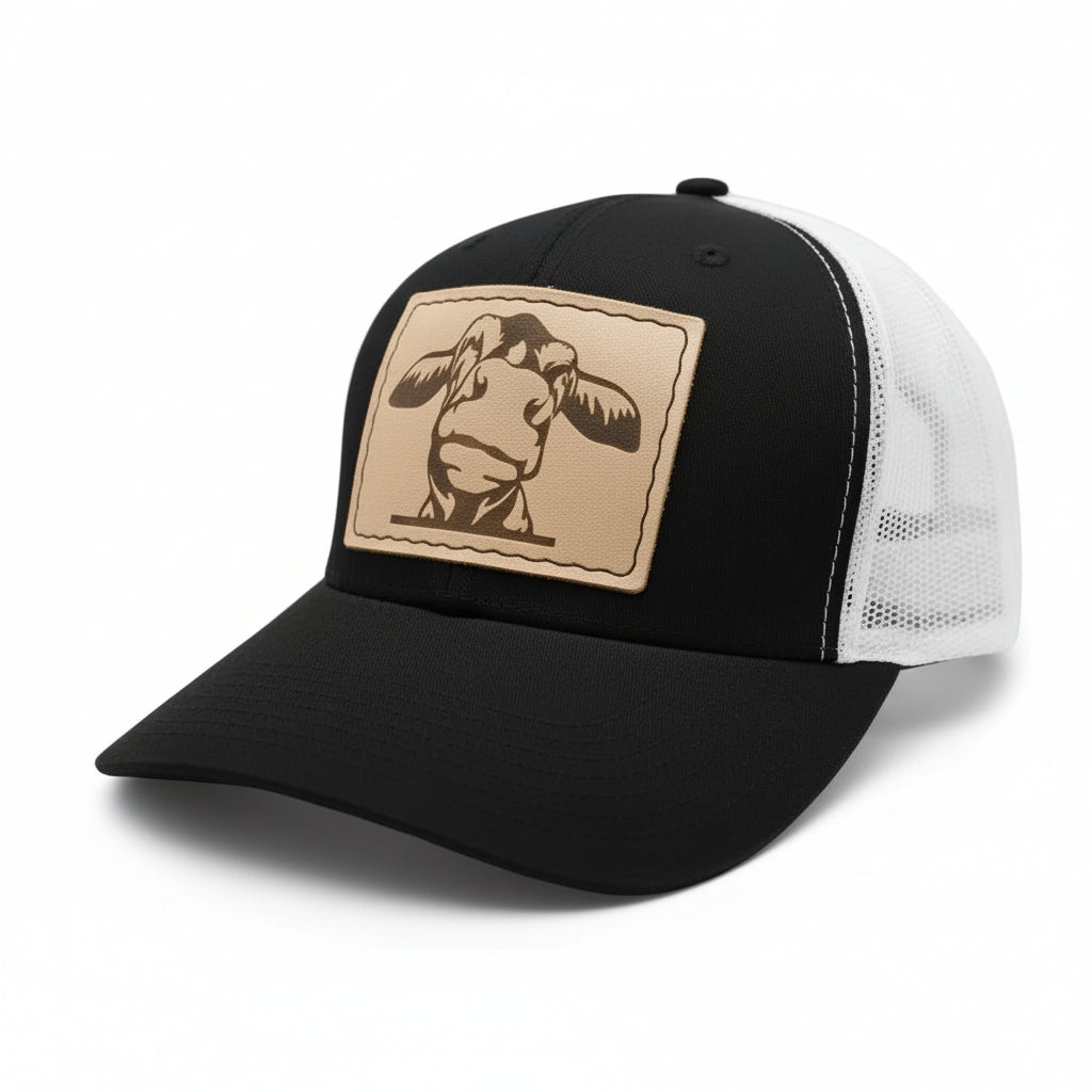 cow leather hat patch sewn onto a black and white hat