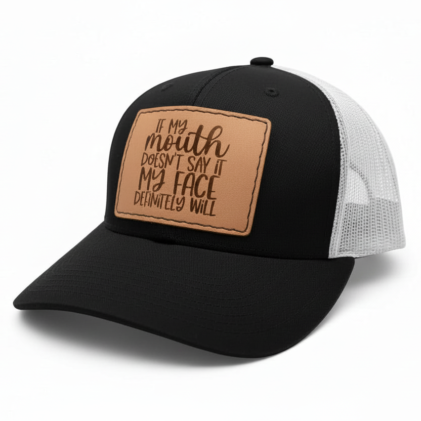 Black and white cap with a brown leather patch on a white background