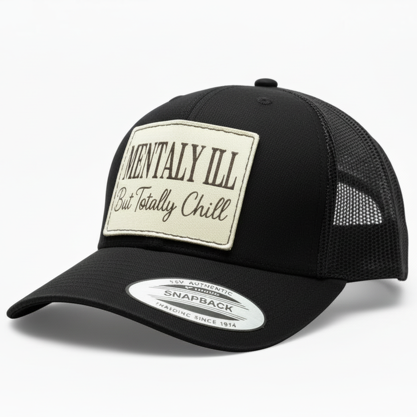 Black trucker cap with a white patch on a white background