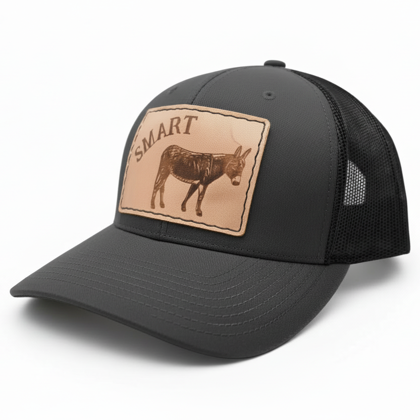Black cap with a leather patch featuring a donkey and 'SMART' branding on a white background